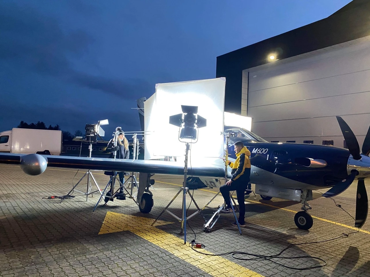 Night shoot lighting setup next to an aircraft